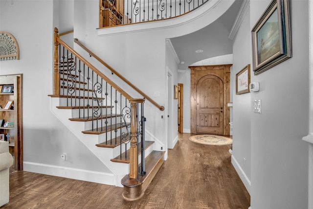 2911 Butterfield Trl, Sherman, TX 75092 - foyer entrance with wood finished floors, a high ceiling, stairs, and crown molding