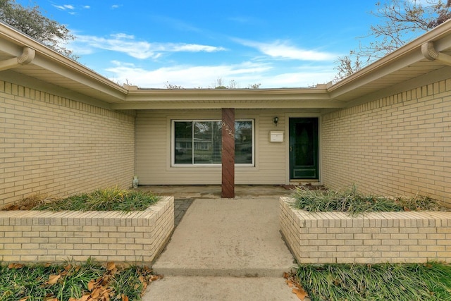 6225 Franwood Ter, Fort Worth, TX 76112 - entrance to property featuring brick siding and a patio