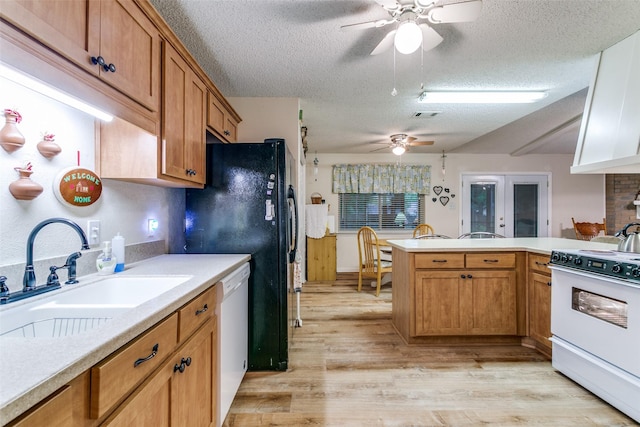 5312 Vermillion Trl, Arlington, TX 76017 - kitchen with white appliances, ceiling fan, a textured ceiling, light wood-type flooring, and light countertops