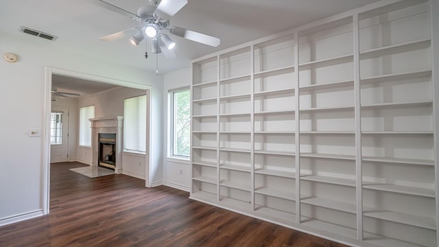 111 Scenic Dr, Dublin, TX 76446 - unfurnished living room featuring ceiling fan, dark wood-style floors, healthy amount of natural light, and a fireplace