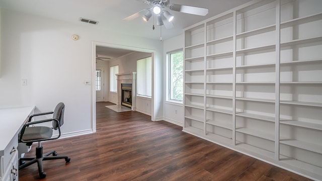 111 Scenic Dr, Dublin, TX 76446 - unfurnished office featuring a ceiling fan, dark wood-style flooring, and a fireplace with flush hearth