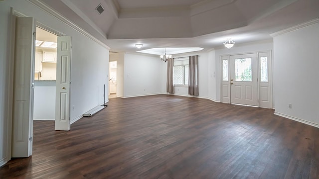 111 Scenic Dr, Dublin, TX 76446 - unfurnished living room featuring a tray ceiling, a chandelier, dark wood-style flooring, and crown molding