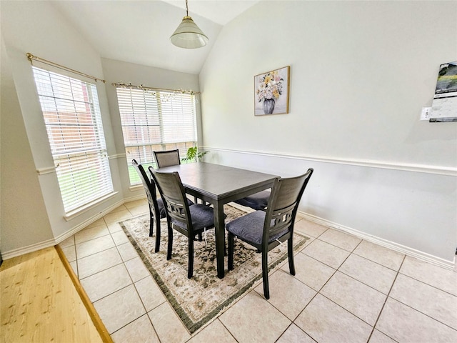 1412 Meadow Dr, Irving, TX 75063 - dining area featuring vaulted ceiling and light tile patterned flooring