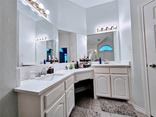 1412 Meadow Dr, Irving, TX 75063 - bathroom with tile patterned floors, double vanity, and a shower