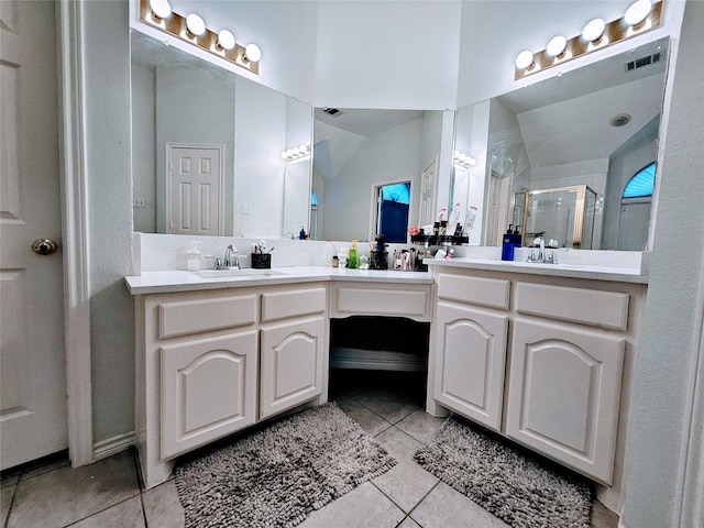 1412 Meadow Dr, Irving, TX 75063 - bathroom with tile patterned flooring, double vanity, and a stall shower