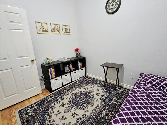 1412 Meadow Dr, Irving, TX 75063 - bedroom with baseboards and wood finished floors