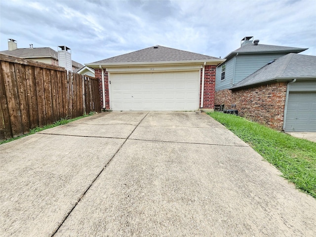 1412 Meadow Dr, Irving, TX 75063 - view of home's exterior with brick siding and a garage