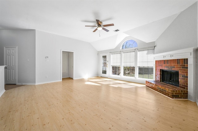 1412 Meadow Dr, Irving, TX 75063 - unfurnished living room with a ceiling fan, light wood finished floors, a fireplace, and lofted ceiling