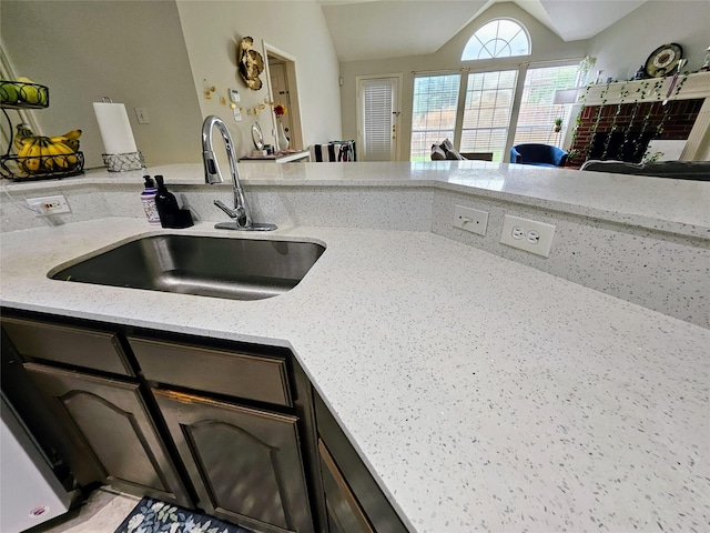 1412 Meadow Dr, Irving, TX 75063 - kitchen featuring vaulted ceiling and light stone counters