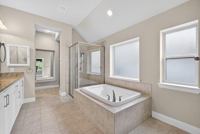 421 Fenceline Dr, Argyle, TX 76226 - bathroom featuring vanity, a bath, a shower stall, vaulted ceiling, and tile patterned floors