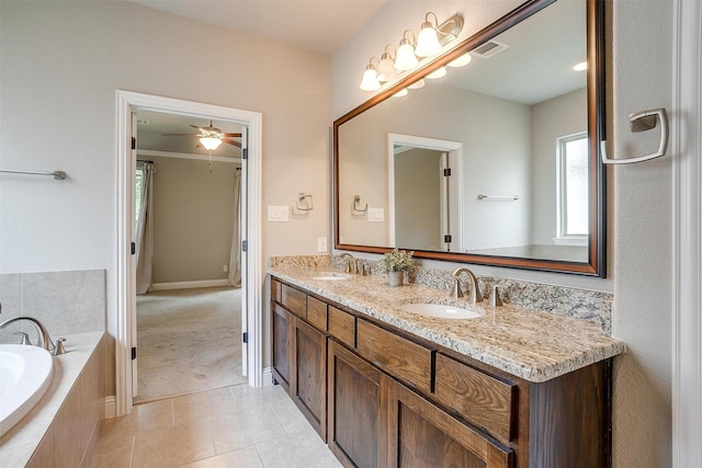 302 Blue Stem Ln, Aledo, TX 76008 - bathroom with double vanity, a bath, tile patterned floors, and a ceiling fan