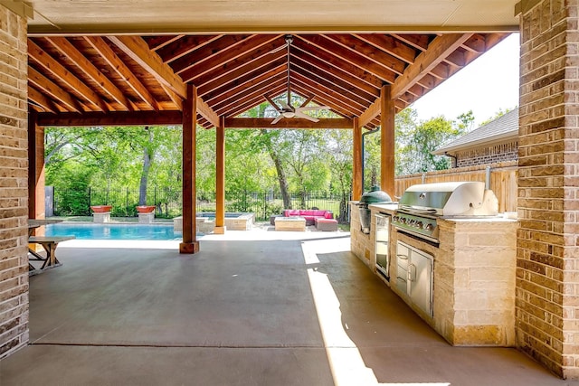 302 Blue Stem Ln, Aledo, TX 76008 - view of patio / terrace with an outdoor kitchen, a ceiling fan, view of wooded area, and a pool with connected hot tub