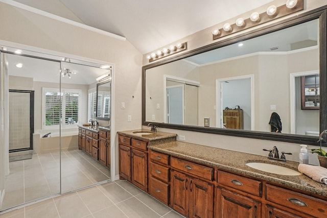5229 Brettenmeadow Dr, Grapevine, TX 76051 - full bathroom with double vanity, tile patterned floors, a bath, a stall shower, and vaulted ceiling