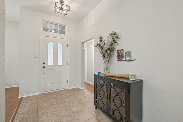 5229 Brettenmeadow Dr, Grapevine, TX 76051 - foyer entrance with a chandelier and a textured wall