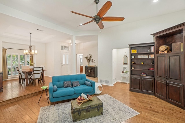 5229 Brettenmeadow Dr, Grapevine, TX 76051 - living room with ceiling fan, a chandelier, and light wood-style flooring
