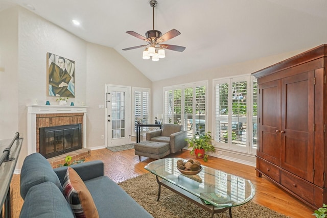 5229 Brettenmeadow Dr, Grapevine, TX 76051 - living room with light wood-style floors, a fireplace, ceiling fan, and high vaulted ceiling