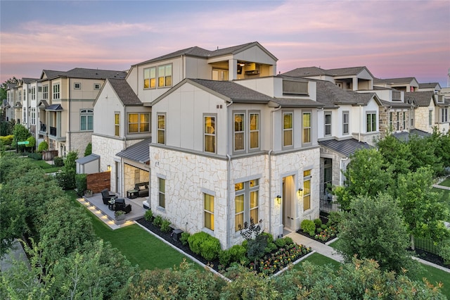 5495 Ashby Grove St, Dallas, TX 75209 - view of front of property with stone siding, a residential view, board and batten siding, and a balcony