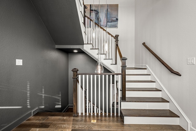 5495 Ashby Grove St, Dallas, TX 75209 - staircase featuring wood finished floors and a textured wall