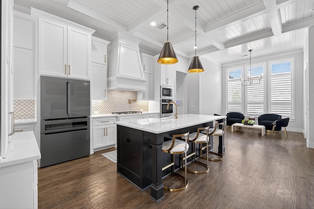 3387 Bellcrest Way, Celina, TX 75009 - kitchen featuring custom exhaust hood, appliances with stainless steel finishes, dark wood finished floors, light countertops, and beam ceiling