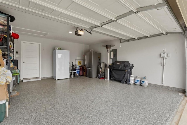 7118 Pampas Pl, Grand Prairie, TX 76804 - garage featuring freestanding refrigerator, a garage door opener, and electric panel