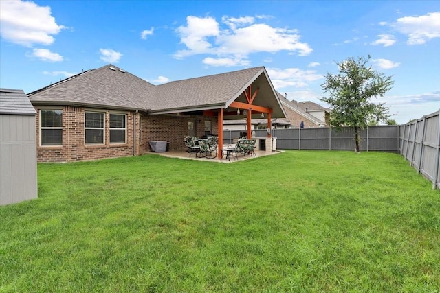 7118 Pampas Pl, Grand Prairie, TX 76804 - rear view of property with a shingled roof, a fenced backyard, brick siding, and a patio area