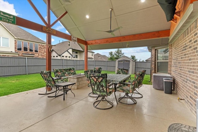 7118 Pampas Pl, Grand Prairie, TX 76804 - fenced backyard with outdoor dining area, a shed, a patio area, and a ceiling fan
