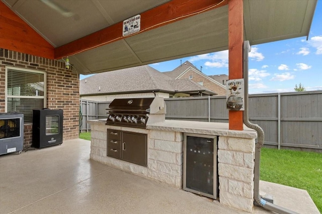 7118 Pampas Pl, Grand Prairie, TX 76804 - view of patio featuring an outdoor kitchen and wine cooler