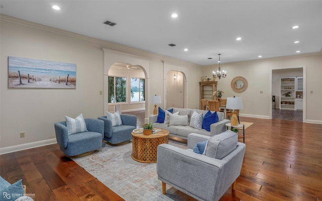 1078 Waters Edge Cir, Shreveport, LA 71106 - living area with ornamental molding, hardwood / wood-style flooring, arched walkways, recessed lighting, and a chandelier