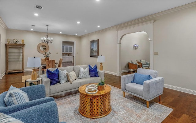 1078 Waters Edge Cir, Shreveport, LA 71106 - living area featuring arched walkways, ornamental molding, a chandelier, recessed lighting, and wood finished floors