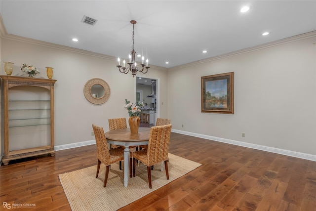 1078 Waters Edge Cir, Shreveport, LA 71106 - dining room featuring ornamental molding, a chandelier, dark wood-type flooring, and recessed lighting