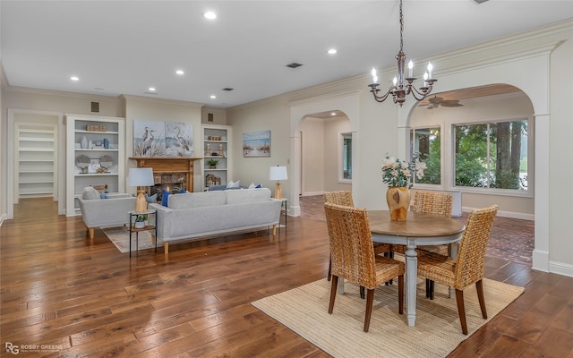 1078 Waters Edge Cir, Shreveport, LA 71106 - dining room with arched walkways, ornamental molding, a chandelier, hardwood / wood-style floors, and recessed lighting