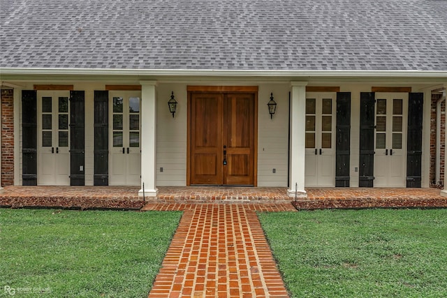 1078 Waters Edge Cir, Shreveport, LA 71106 - property entrance featuring roof with shingles, a porch, and a yard