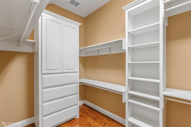 1078 Waters Edge Cir, Shreveport, LA 71106 - spacious closet with wood finished floors