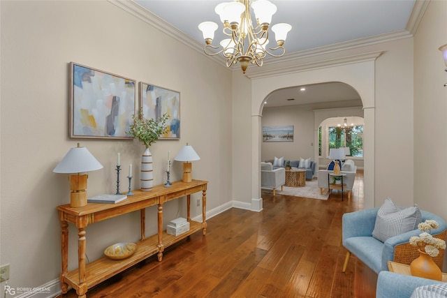 1078 Waters Edge Cir, Shreveport, LA 71106 - corridor with a chandelier, arched walkways, hardwood / wood-style flooring, and crown molding
