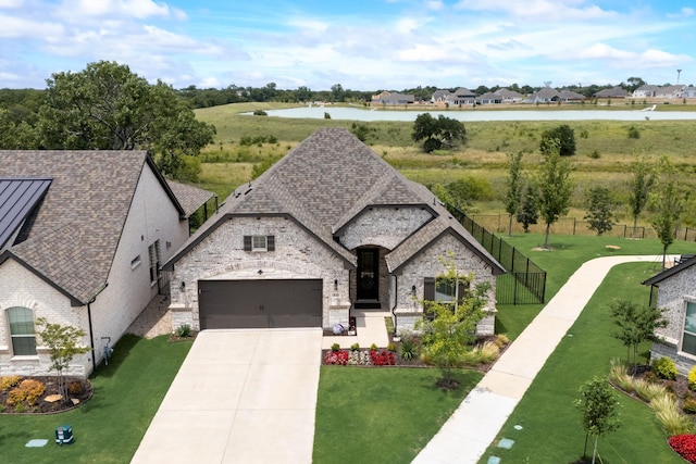 834 Cordoba Ln, Rockwall, TX 75087 - view of front of house featuring stone siding, concrete driveway, an attached garage, and a shingled roof