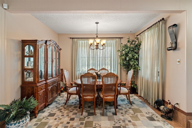 3503 Red Bud Dr, Weatherford, TX 76087 - dining area with a chandelier and a textured ceiling
