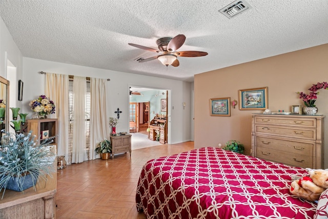3503 Red Bud Dr, Weatherford, TX 76087 - bedroom with a textured ceiling and a ceiling fan