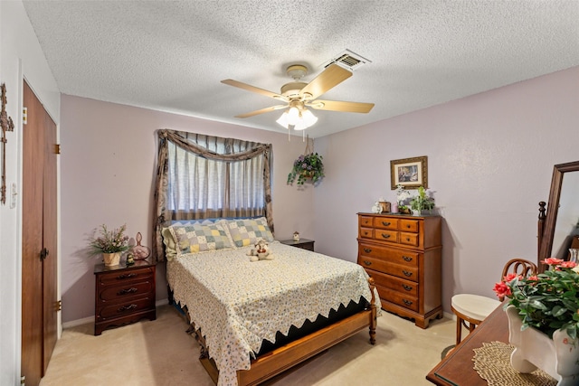 3503 Red Bud Dr, Weatherford, TX 76087 - bedroom with light carpet, a ceiling fan, and a textured ceiling