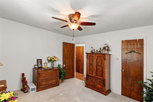 3503 Red Bud Dr, Weatherford, TX 76087 - carpeted bedroom featuring a textured ceiling and a ceiling fan