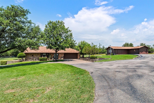 3503 Red Bud Dr, Weatherford, TX 76087 - single story home with a front lawn, asphalt driveway, and a garage