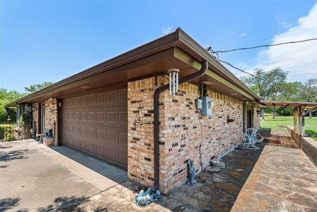 3503 Red Bud Dr, Weatherford, TX 76087 - view of property exterior with brick siding and a garage