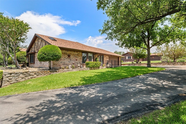 3503 Red Bud Dr, Weatherford, TX 76087 - ranch-style house with an attached garage, a front lawn, brick siding, and driveway