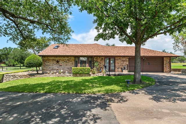 3503 Red Bud Dr, Weatherford, TX 76087 - ranch-style home with brick siding, an attached garage, concrete driveway, and roof with shingles