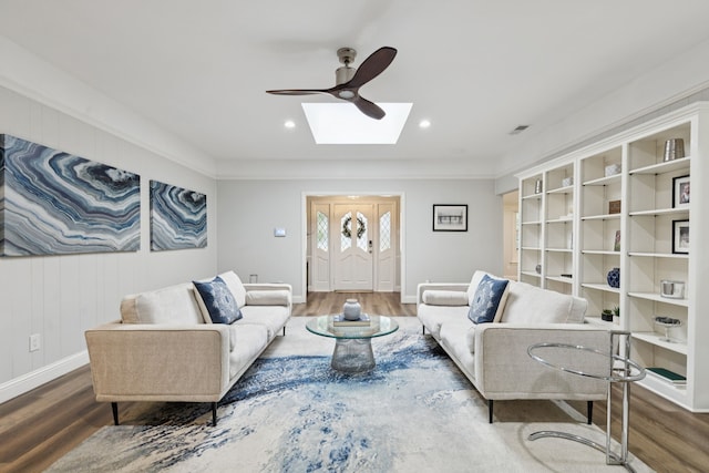 9735 Trevor Dr, Dallas, TX 75243 - living area with wood finished floors, a ceiling fan, a skylight, and recessed lighting