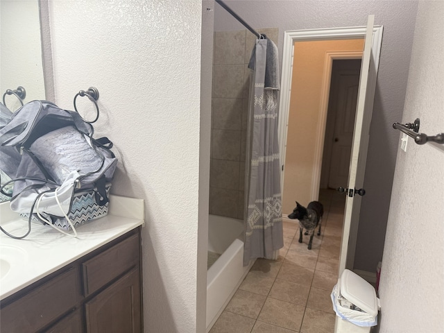 124 Brady Coleman Ln, Springtown, TX 76082 - full bath featuring tile patterned flooring, shower / tub combo with curtain, a textured wall, and vanity