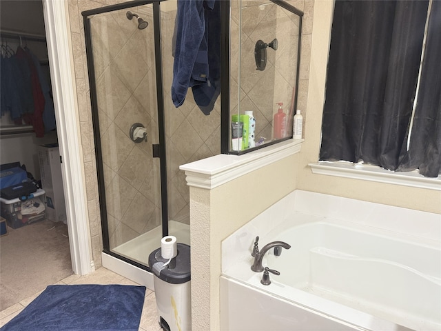 124 Brady Coleman Ln, Springtown, TX 76082 - bathroom with a bath, a walk in closet, and a stall shower