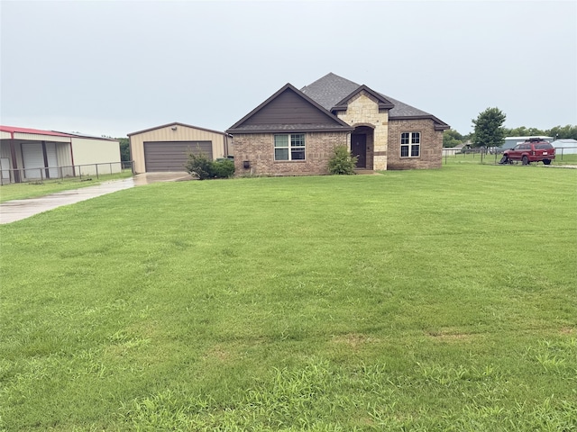 124 Brady Coleman Ln, Springtown, TX 76082 - view of front of home with an outbuilding, a garage, brick siding, and roof with shingles