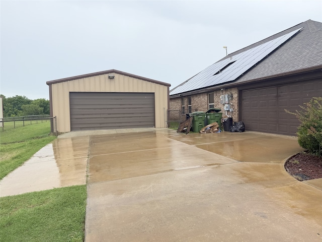124 Brady Coleman Ln, Springtown, TX 76082 - detached garage featuring roof mounted solar panels