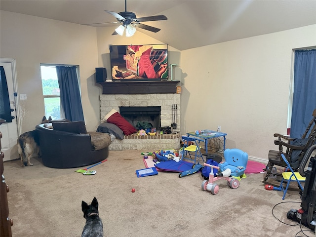 124 Brady Coleman Ln, Springtown, TX 76082 - carpeted living room with a ceiling fan, lofted ceiling, and a fireplace