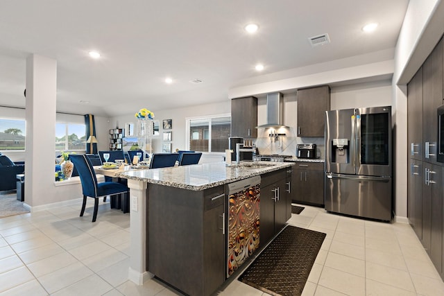 521 Bermuda Ave, Lancaster, TX 75146 - kitchen featuring stainless steel fridge, wall chimney range hood, dishwasher, dark brown cabinetry, and recessed lighting